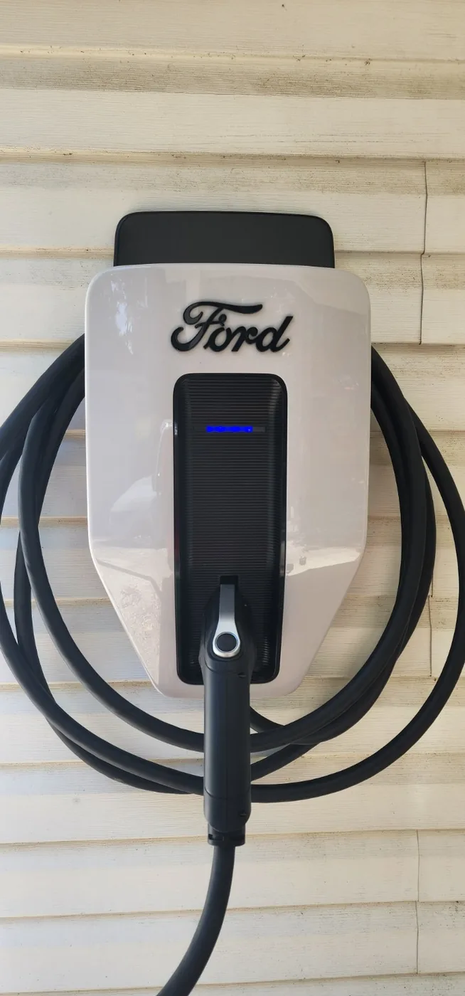 Ford home EV charger installed on an exterior wall